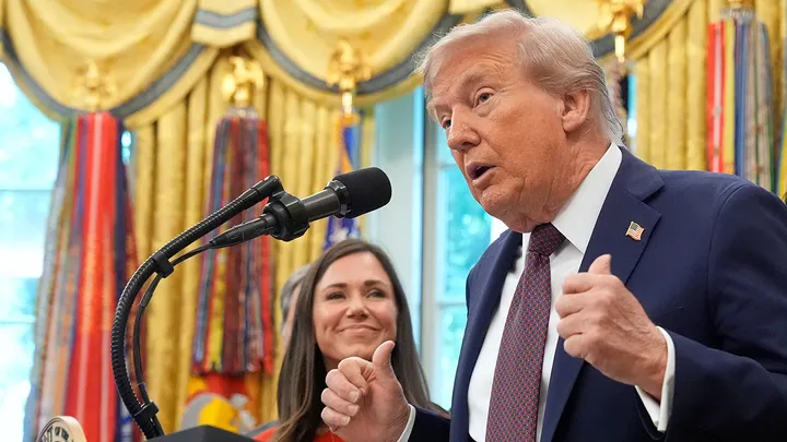 President Donald Trump speaks in the Oval Office of the White House on Tuesday, in Washington, D.C., as Sen. Katie Britt, R-Ala., listens. During the news conference, Trump announced that the U.S. military had "shot out" a drug boat from Venezuela in the southern Caribbean. (AP Photo/Mark Schiefelbein)