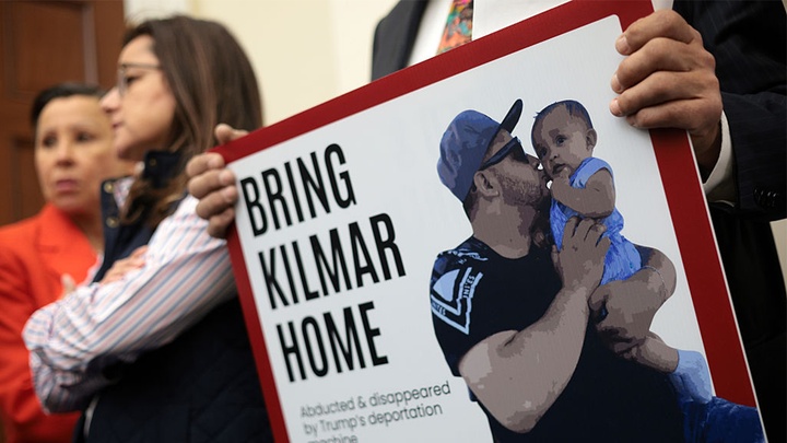 A member of the Congressional Hispanic Caucus holds a picture of Kilmar Abrego Garcia during a news conference. (Getty Images)