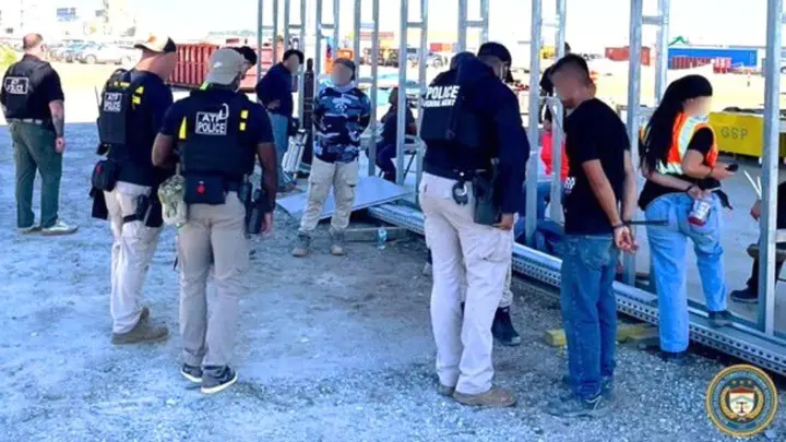 Federal agents detain workers during an immigration raid at the Hyundai battery plant construction site in Ellabell, Ga. (ATF)