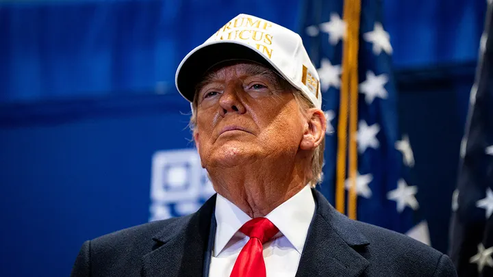 Donald Trump arrives on stage during a campaign event at Simpson College in Indianola, Iowa, Jan. 14, 2024. (Al Drago/Bloomberg via Getty Images)