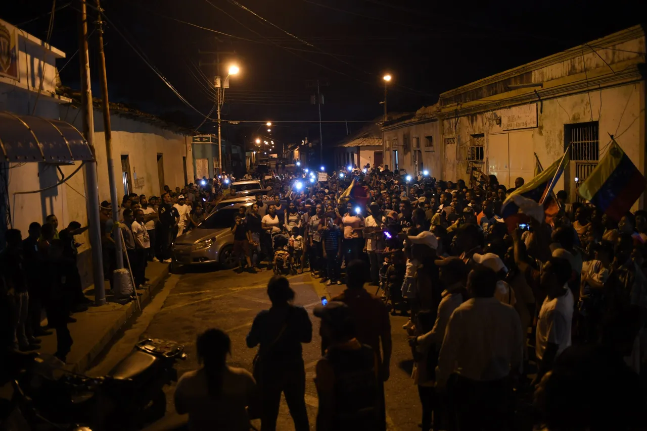 Relatives and friends of 28 Venezuelan migrants who died in the wreck of a boat transporting them to Trinidad and Tobago, protest in the streets of Guiria, Venezuela on December 17, 2020. – At least 28 Venezuelan migrants died when a boat heading for Trinidad and Tobago sank, Attorney General Tarek William Saab said on Thursday. (Photo by YURI CORTEZ/AFP via Getty Images)