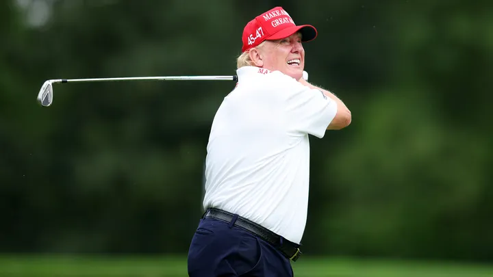 Former President Donald Trump follows his tee shot on the third tee during the pro-am prior to the LIV Golf Invitational - Bedminster at Trump National Golf Club in Bedminster, N.J., Aug. 10, 2023. (Mike Stobe/Getty Images)