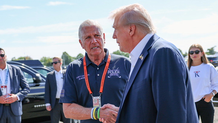President Donald Trump is greeted by Bruce Blakeman, county executive of Nassau County, Sept. 26, in Farmingdale, N.Y.  (Anna Moneymaker/Getty Images)