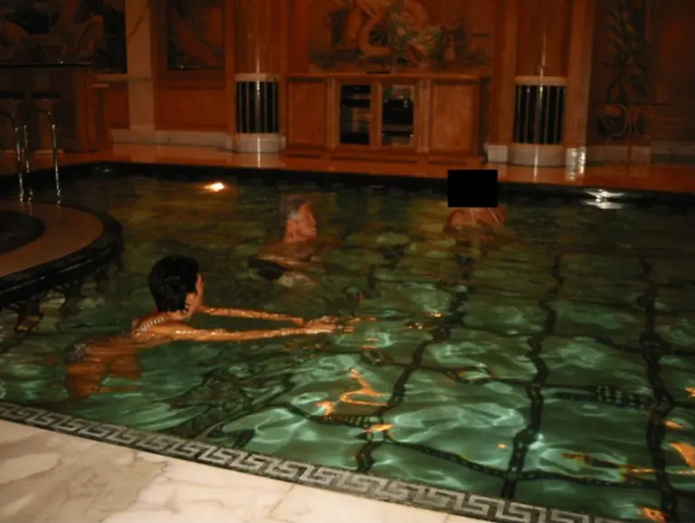 Clinton is seen swimming in a pool with Epstein&rsquo;s madam, Ghislaine Maxwell, and a woman whose face is redacted. ZUMAPRESS.com