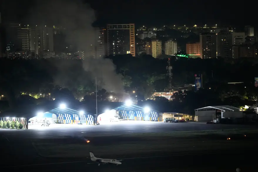 Smoke rises at La Carlota airport after a reported overnight explosion on Jan. 3, 2026. AP