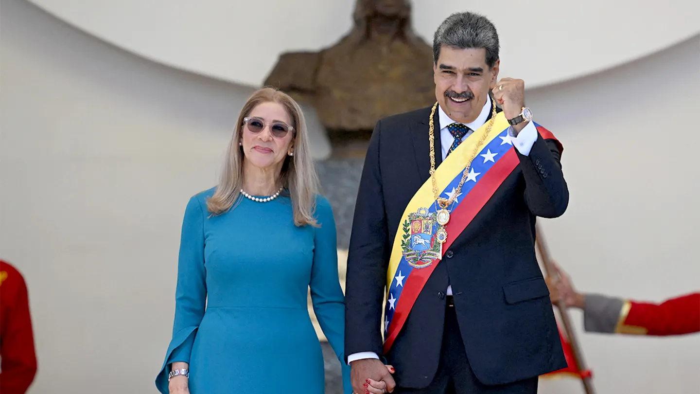 Venezuelan President Nicol&aacute;s Maduro gestures next to his wife Cilia Flores as they leave the Capitolio, home of the National Assembly, after taking the oath during the presidential inauguration in Caracas on Jan. 10, 2025. (Juan Barreto/AFP via Getty Images)