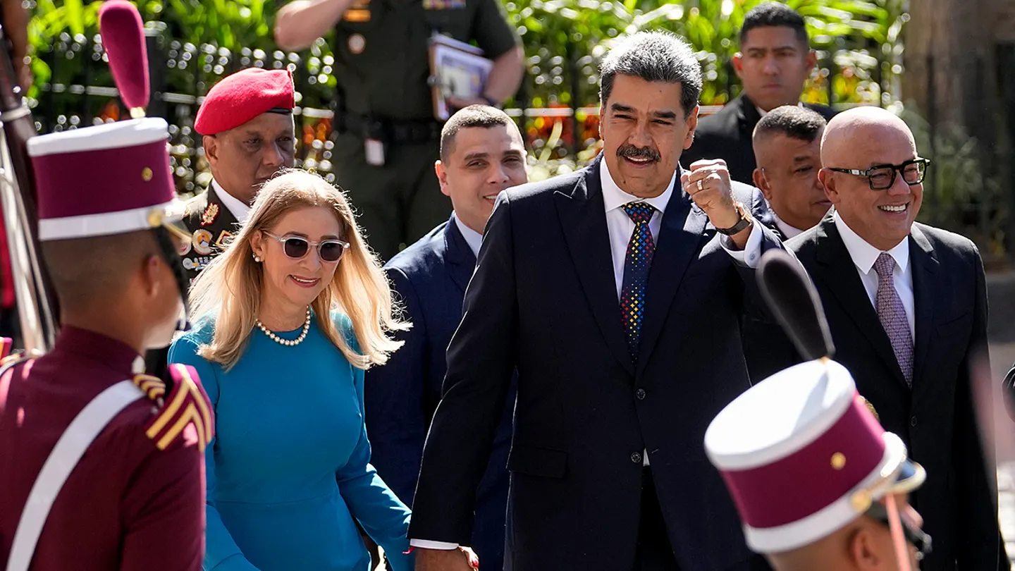 Venezuelan President Nicol&aacute;s Maduro and his wife Cilia Flores arrive at the National Assembly for his swearing-in ceremony for a third term in Caracas, Venezuela, Jan. 10, 2025. (Matias Delacroix, File/AP Photo)