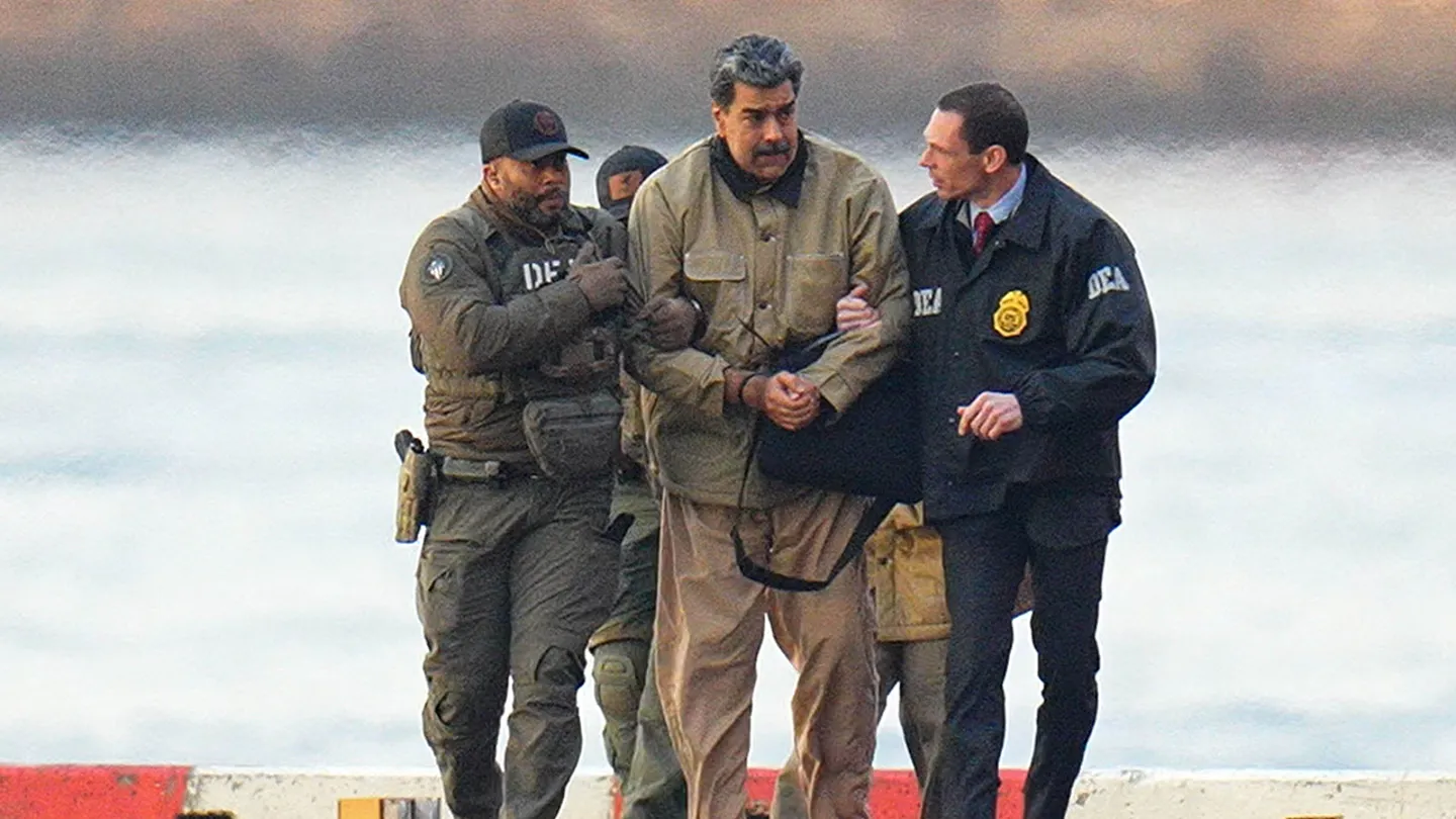 Nicolas Maduro is seen in handcuffs after landing at a Manhattan helipad, escorted by heavily armed Federal agents as they make their way into an armored car en route to a Federal courthouse in Manhattan on Jan. 5, 2026, in New York City. (XNY/Star Max/GC Images via Getty Images)