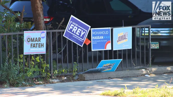 Campaign signs for Minneapolis mayoral and city council candidates line a fence in Cedar–Riverside. (Michael Dorgan/Fox News Digital)