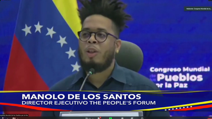 People’s Forum Executive Director Manolo De Los Santos speaks at the People’s World Congress for Peace in Caracas, Venezuela, on Dec. 10, 2021. (Image credit: X.com/@NicolasMaduro)