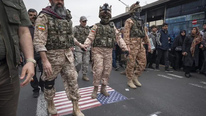 Islamic Revolutionary Guard Corps (IRGC) Special forces walk on the U.S. flag during a rally commemorating International Quds Day, also known as Jerusalem Day, in Tehran, Iran, on March 28, 2025.  (Morteza Nikoubazl/NurPhoto via Getty Images)