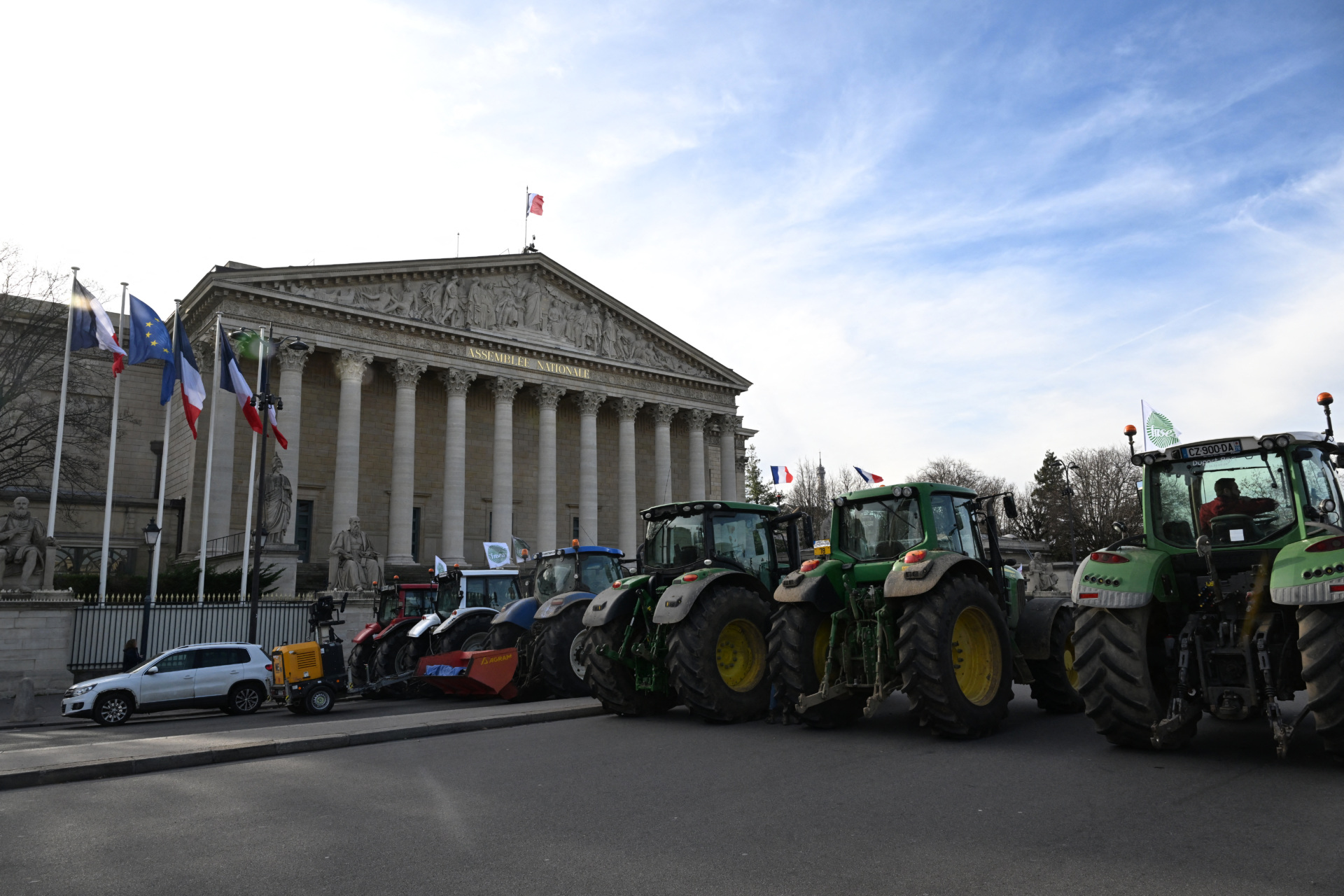 This photograph shows tractors parked in front of the National Assembly to demand &ldquo;concrete and immediate action&rdquo; from the government, which is struggling to deal with the anger of farmers in Paris on January 13, 2026. Called by the French union National Federation of Agricultural Holders&rsquo; Unions (FNSEA) and &ldquo;Jeunes Agriculteurs&rdquo; union and a few days before the signing of the EU-Mercosur agreement, a convoy of farmers entered the capital early in the morning. (Photo by Martin LELIEVRE / AFP via Getty Images)