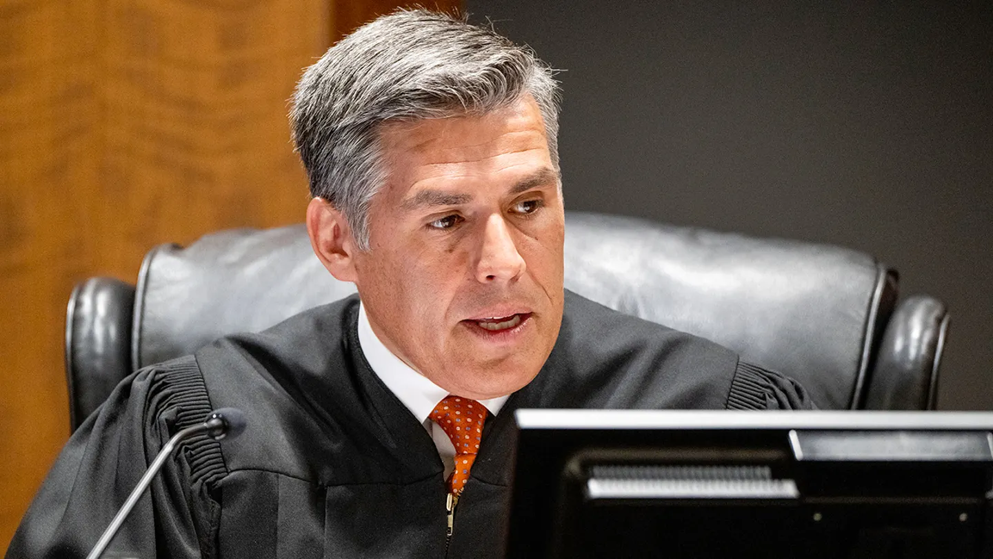 4th District Court Judge Tony Graf reads the charging documents as Tyler Robinson, 22, the suspect in the shooting death of Charlie Kirk, appeared by camera on Tuesday, Sept. 16, 2025, for his initial appearance in Provo, Utah. (Scott G Winterton/Pool via Deseret News)