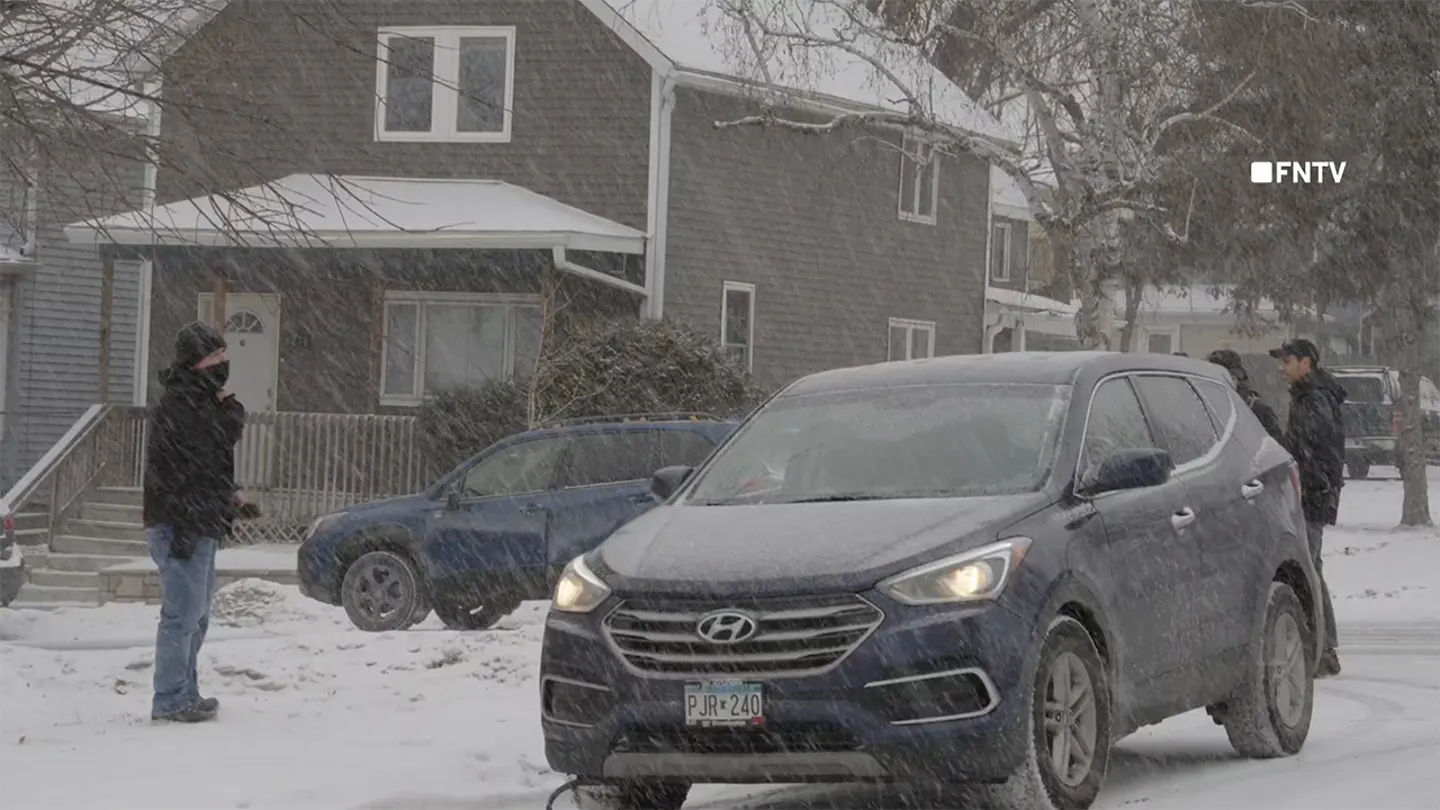 The video then cuts to the agent standing in the snow next to a vehicle as it honks. (FNTV)