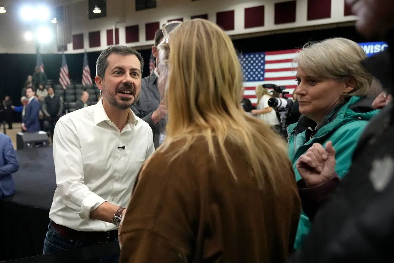 LA CROSSE, WISCONSIN – JANUARY 16: Pete Buttigieg shakes hands with an attendee after a town hall he led at the La Crosse Center on January 16, 2026 in La Crosse, Wisconsin. (Photo by Kayla Wolf/Getty Images)