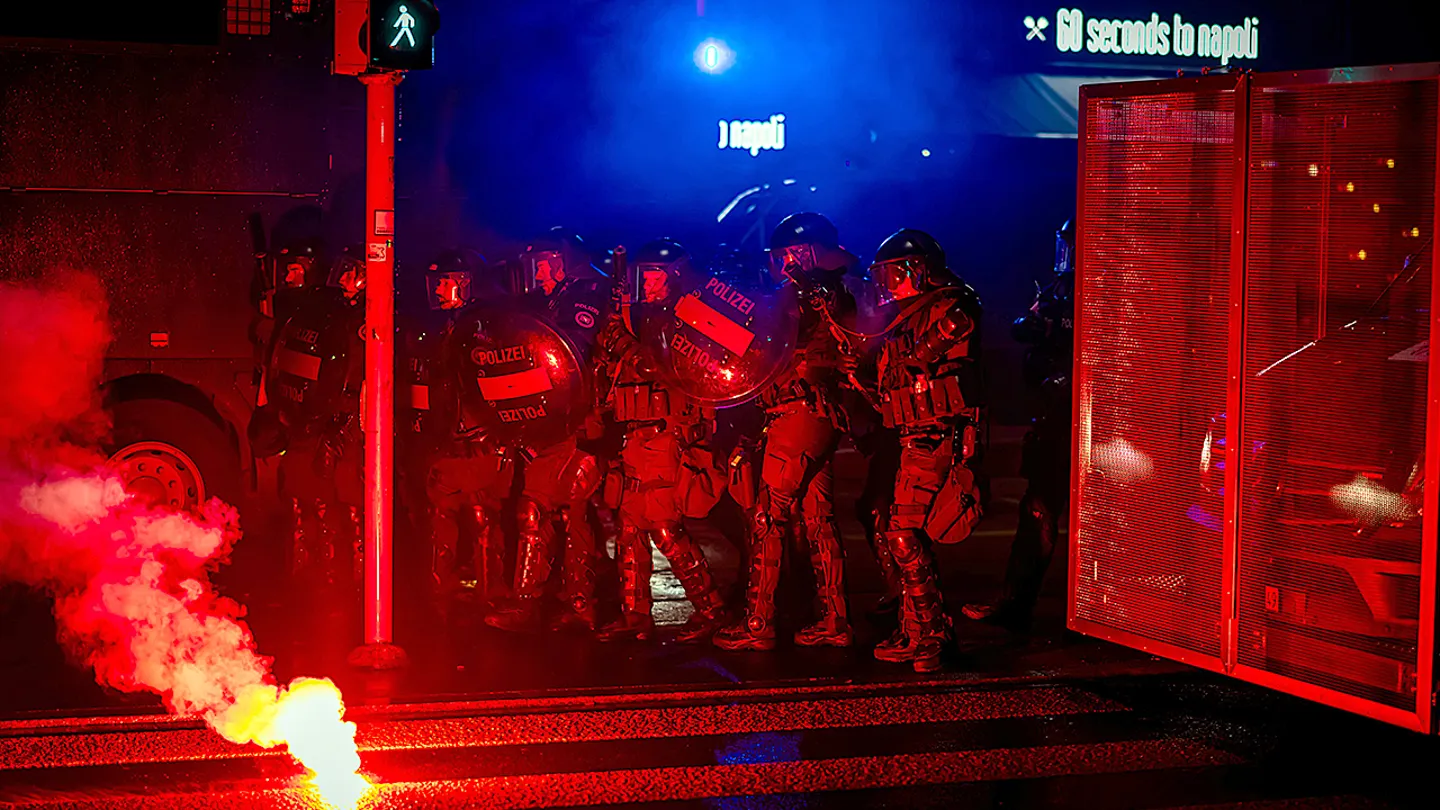 Roughly 300 demonstrators clashed with riot police who deployed water cannons and rubber bullets. (Michael Buholzer/Keystone via AP)