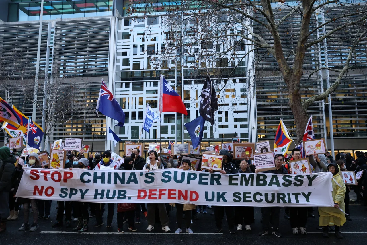 Protesters gather with placards in London on December 6, 2025, to demonstrate against a proposal to move China’s embassy to a new site, a stones-throw from The Tower of London and call for the UK Government “to acknowledge its responsibility in the Far East”. (Photo by Toby Shepheard / AFP via Getty Images)