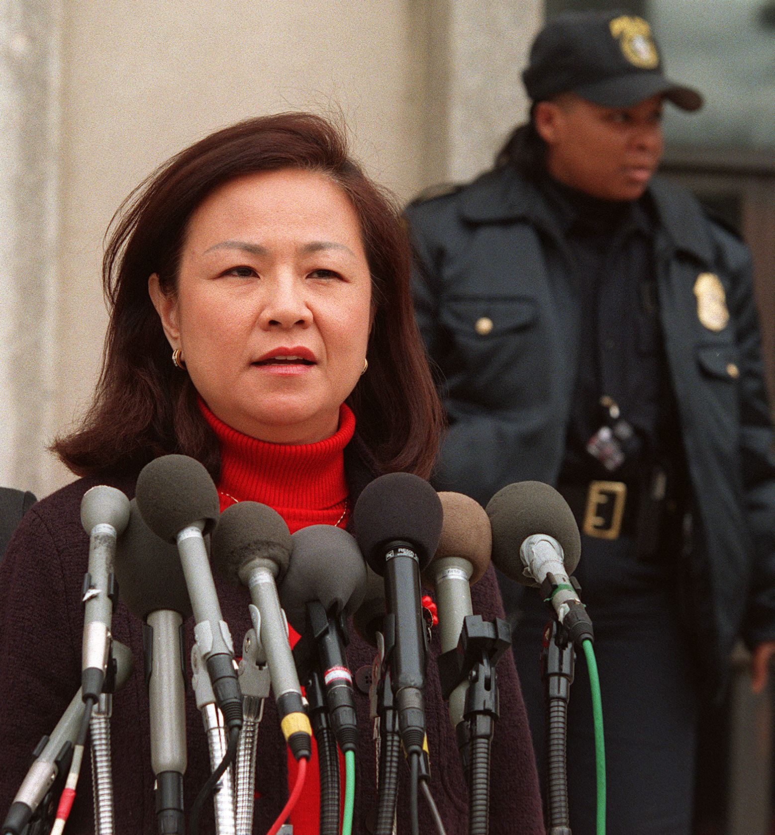 Democratic fund-raiser Maria Hsia speaks to reporters outside of a courthouse on February 19, 1998 in Washington, DC, after her arraignment on charges that she sought to hide illegal campaign contributions. (WILLIAM PHILPOTT/AFP via Getty Images)