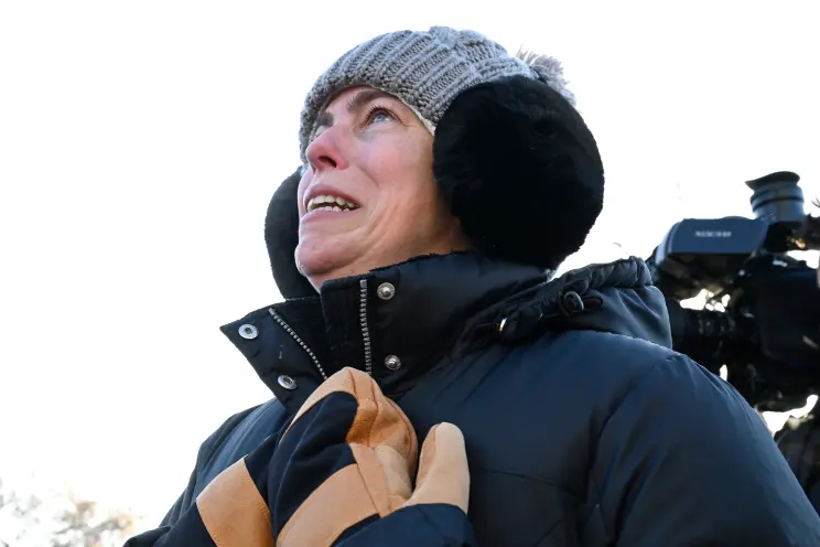 A woman reacts after a shooting involving federal officers in Minneapolis, Minnesota, on January 24, 2026. Getty Images