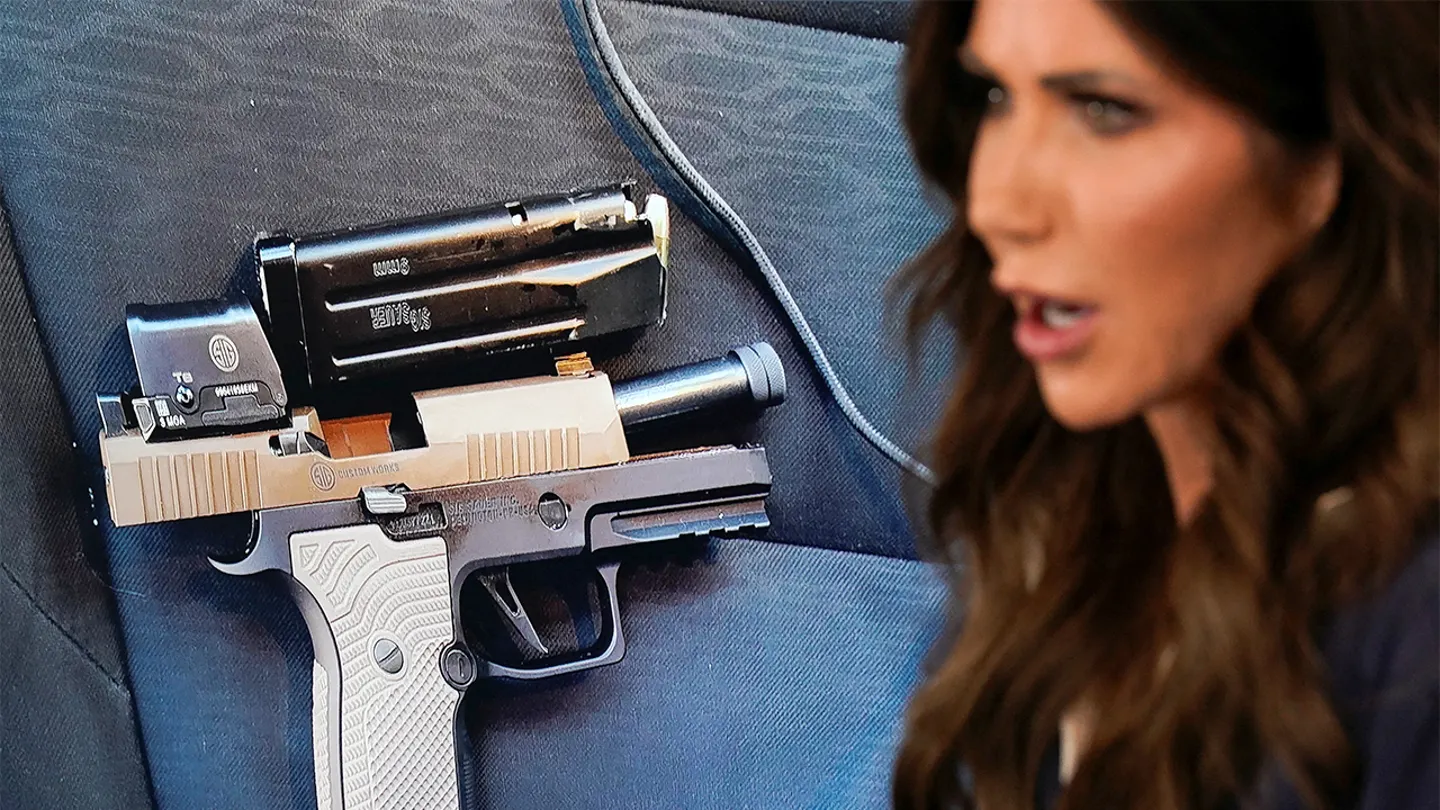 Homeland Security Secretary Kristi Noem speaks beside a screen showing an image of a handgun during a press conference in Washington, D.C., on Jan. 24, 2026. (Nathan Howard/Reuters)