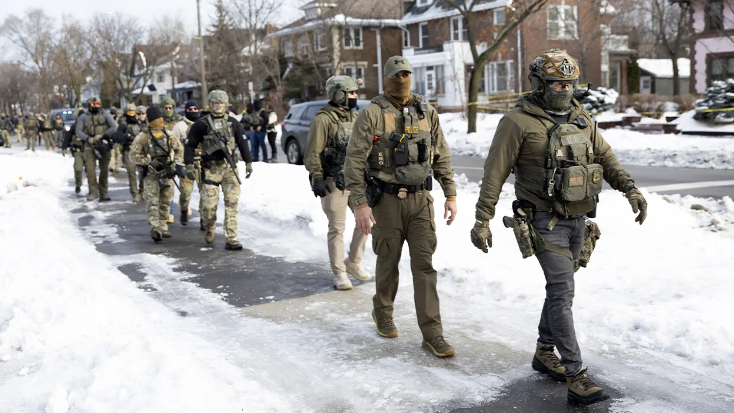 ICE agents stand at the scene where a woman was fatally shot during an enforcement operation on Jan. 7, 2026, in Minneapolis, Minnesota. (Christopher Juhn/Anadolu via Getty Images)