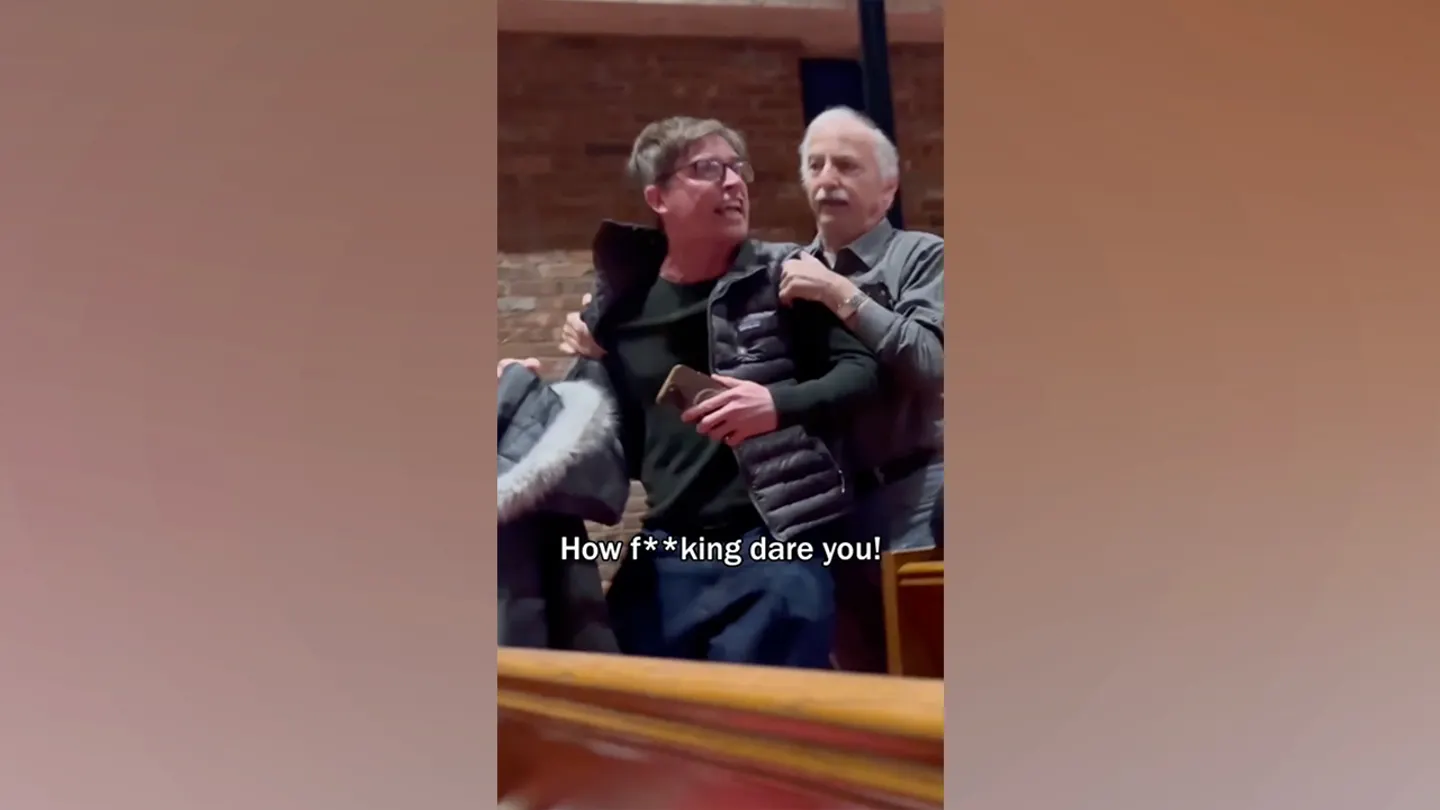 Comedian and activist Walter Masterson appeared to be thrown out of the temple during the disruption while attempting to read aloud the names of individuals he said had died in ICE-related incidents. (Climate Defiance via Storyful)