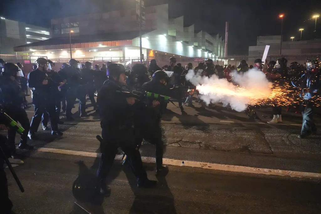 Los Angeles police fire less lethal rounds at protesters in downtown Los Angeles on Friday, Jan. 30, 2026. AP