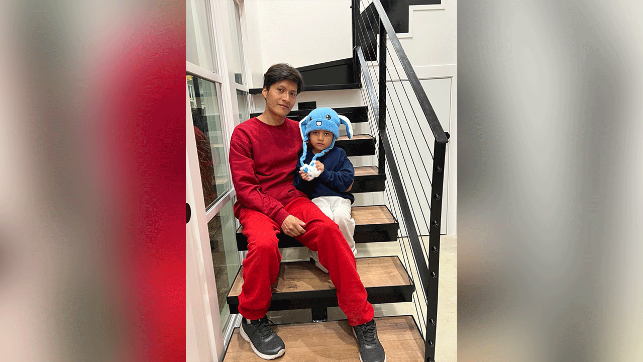Liam Conejo Ramos sits with father Adrian Alexander Conejo Arias after getting released from a detention facility in Texas. (Joaquin Castro)