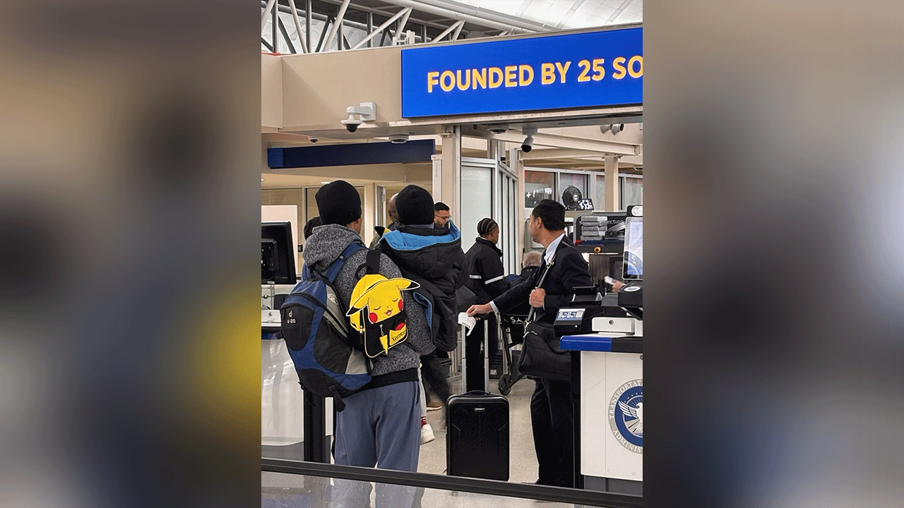 Liam Conejo Ramos and his father pass through airport security after their release from federal custody on Feb. 1, 2026. (Joaquin Castro)