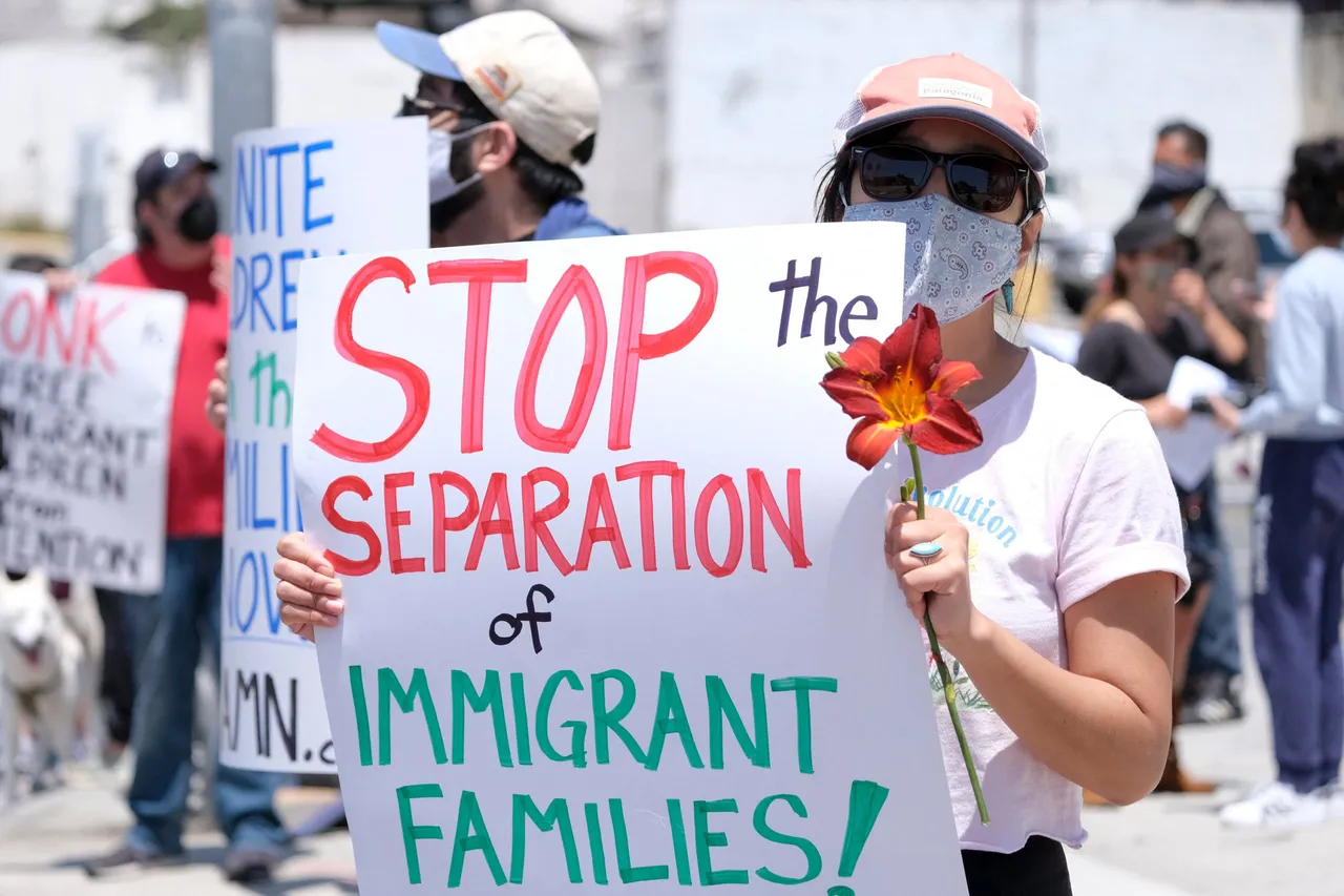 Demonstrators holding signs protest outside Long Beach Convention Center to urge the release of immigrant children from ICE detention centers outside Long Beach Convention Center in Long Beach, California, on May 8, 2021. (Photo by RINGO CHIU/AFP via Getty Images)