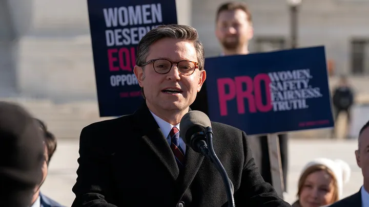 Speaker of the House Mike Johnson, R-La., speaks to the crowd as protesters gather outside the Supreme Court, Jan. 13, 2026, in Washington. (Jose Luis Magana/AP Photo)