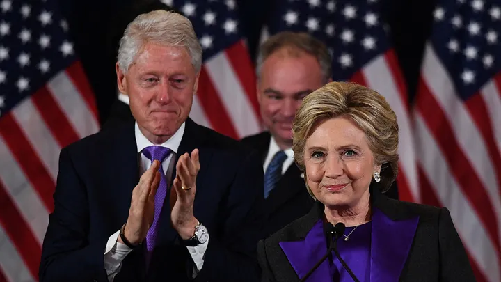 Democratic presidential candidate Hillary Clinton makes a concession speech after being defeated by Republican president-elect Donald Trump as former President Bill Clinton, left, and running mate Tim Kaine look on in New York Nov. 9, 2016. (Jewel Samad/AFP via Getty Images)