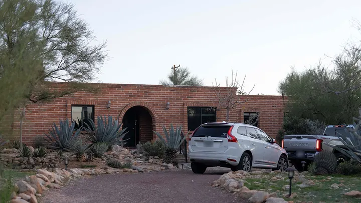 The front of Nancy Guthrie's house after the disappearance of the 84-year-old mother of U.S. journalist and television host Savannah Guthrie, who went missing from her home in Tucson, Arizona, on Feb. 4, 2026.   (Rebecca Noble/Reuters)