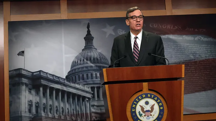 Sen. Mark Warner, D-Va., speaking at a press conference at the U.S. Capitol on Tuesday, has questioned why a whistleblower complaint against Tulsi Gabbard took eight months to reach Congress.  (Kevin Dietsch/Getty Images)