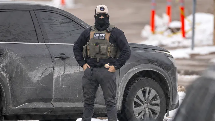 A federal agent prepares to depart the Bishop Henry Whipple Federal Building on Feb. 4, 2026 in Minneapolis. (John Moore/Getty Images)