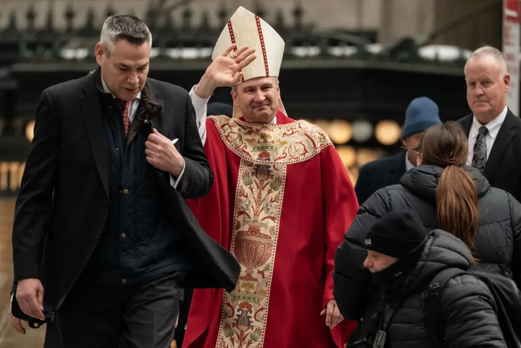 Archbishop-designate Ronald Hicks gestures to supporters while arriving at St. Patrick's Cathedral. 6 Ronald Hicks, 58, on Friday became the 11th archbishop of the New York Archdiocese since 1850. Derek French/SOPA Images/Shutterstock