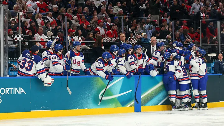 Kirsten Simms (9) of Team United States celebrates with teammates after scoring a goal in the second period during the Women's Preliminary Group A match between the United States and Canada on day four of the Milan Cortina 2026 Winter Olympic Games at Milano Santa Giulia Ice Hockey Arena on Feb. 10, 2026, in Milan, Italy.  (Bruce Bennett/Getty Images)
