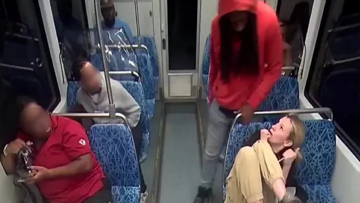 Iryna Zarutska curls up in fear as a man looms over her during a disturbing attack on a Charlotte, N.C., light rail train. (NewsNation via Charlotte Area Transit System)