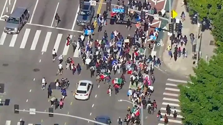 Anti-ICE protesters march during a rally in Downtown Los Angeles on Friday, February 13, 2026. (KTTV)