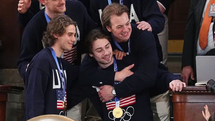 Jack Hughes poses for a photo with Team USA members Tuesday, Feb. 24, 2026. (AP Photo/Matt Rourke)