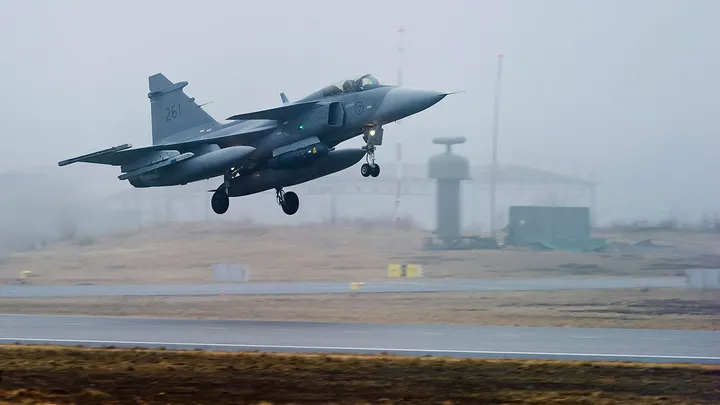 One of three Swedish Air Force JAS 39 Gripen fighter aircraft takes off from the Blekinge Wing F17, based in Kallinge, southern Sweden, for a base in Sardinia to join the NATO-led operation in Libya, on Saturday, April 2, 2011. As Sweden joins NATO, it bids a final farewell to more than two centuries of neutrality. (AP Photo/Scanpix/Patric Soderstrom, File)