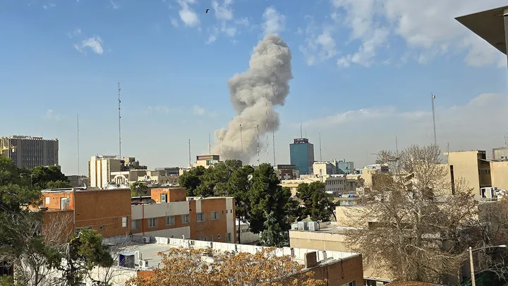 A plume of smoke rises after an explosion on Feb. 28, 2026, in Tehran, Iran. (Majid Saeedi/Getty Images)