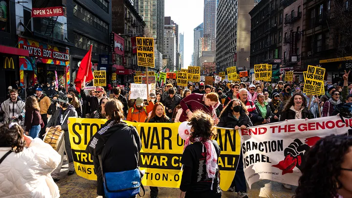Demonstrators march during a protest against war in Iran in New York City on Saturday, Feb. 28, 2026.  (Angelina Katsanis/Bloomberg via Getty Images)