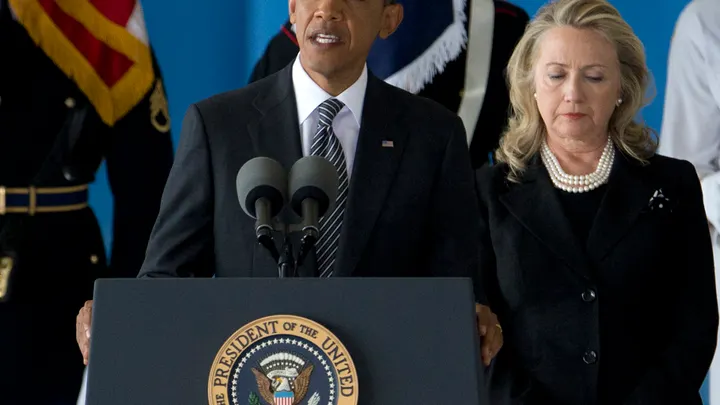 President Barack Obama, accompanied by Secretary of State Hillary Rodham Clinton, speaks during a Transfer of Remains Ceremony, at Andrews Air Force Base, Maryland, on Sept. 14, 2012. (AP)