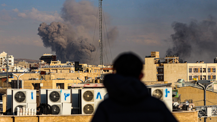 A general view of Tehran with smoke visible in the distance after explosions were reported in the city, Monday, in Iran. (Contributor/Getty Images)