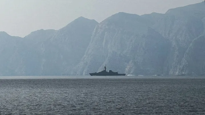A navy vessel sails in the Strait of Hormuz, a vital waterway through which much of the world's oil and gas passes, March 1, 2026.  (Sahar Al Attar/AFP via Getty Images / Getty Images)