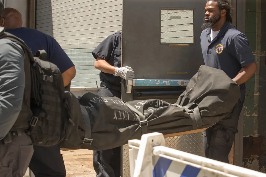 Medical personnel transporting a body in a black bag from a hospital side door. 5 Epstein was found dead in his cell when Thomas and Noel brought him breakfast at 6:30 a.m. on Aug. 10, 2019. William Farrington
