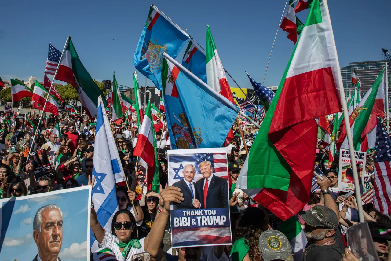 LOS ANGELES, CALIFORNIA &ndash; MARCH 01: A man holds pictures of Reza Pahlavi, son of the former Shah of Iran while another man holds a photo of the Israel Prime Minister Benjamin Netanyahu and the US President Donald Trump as People wave Iranian pre-1979 Islamic Revolution while members of the Iranian community celebrate in front of the Federal Building on March 1, 2026 in Los Angeles, California. (Photo by Apu Gomes/Getty Images)