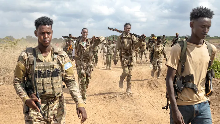 Soldiers of the Somalia National Army walk near the front lines at Sabiid, one of the towns they liberated from the al Qaeda-linked militants, Al-Shabaab, in Somalia's Lower Shabelle region Nov. 11, 2025. (Tony Karumba/AFP via Getty Images)