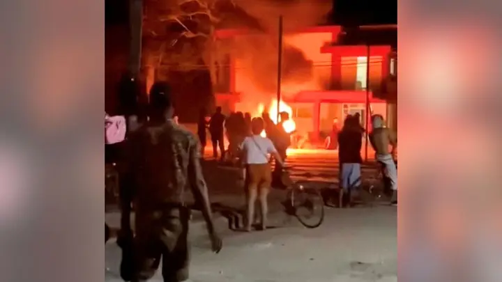 Protesters gather outside a Communist Party headquarters in Morón, Cuba, as a fire burns in the street during overnight unrest. Video obtained by Fox News Digital appeared to show demonstrators attempting to set fire to the building amid protests linked to widespread blackouts. (Reuters)